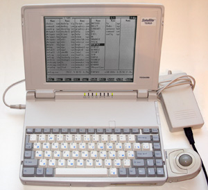 Ноутбук Toshiba Sattelite T1910 в рабочем состоянии с запущенным нортоном